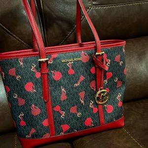 A dark red michael kors large bag!